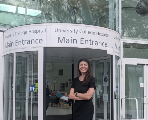 I. Cosmina Stoican in front of College